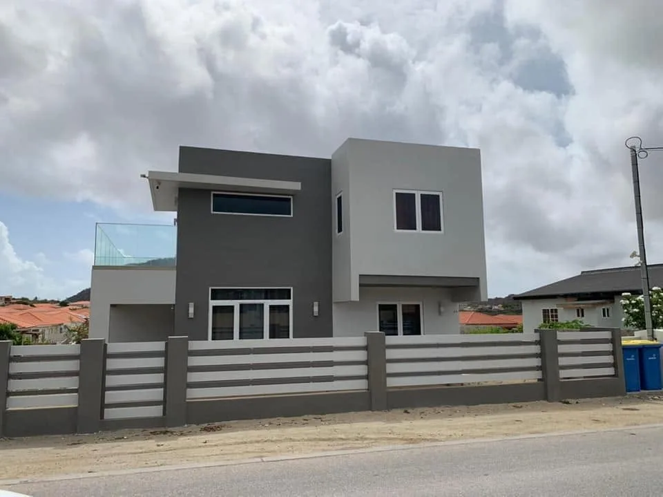 Completed two-storey modern residence built by Kallisto Construction in Aruba